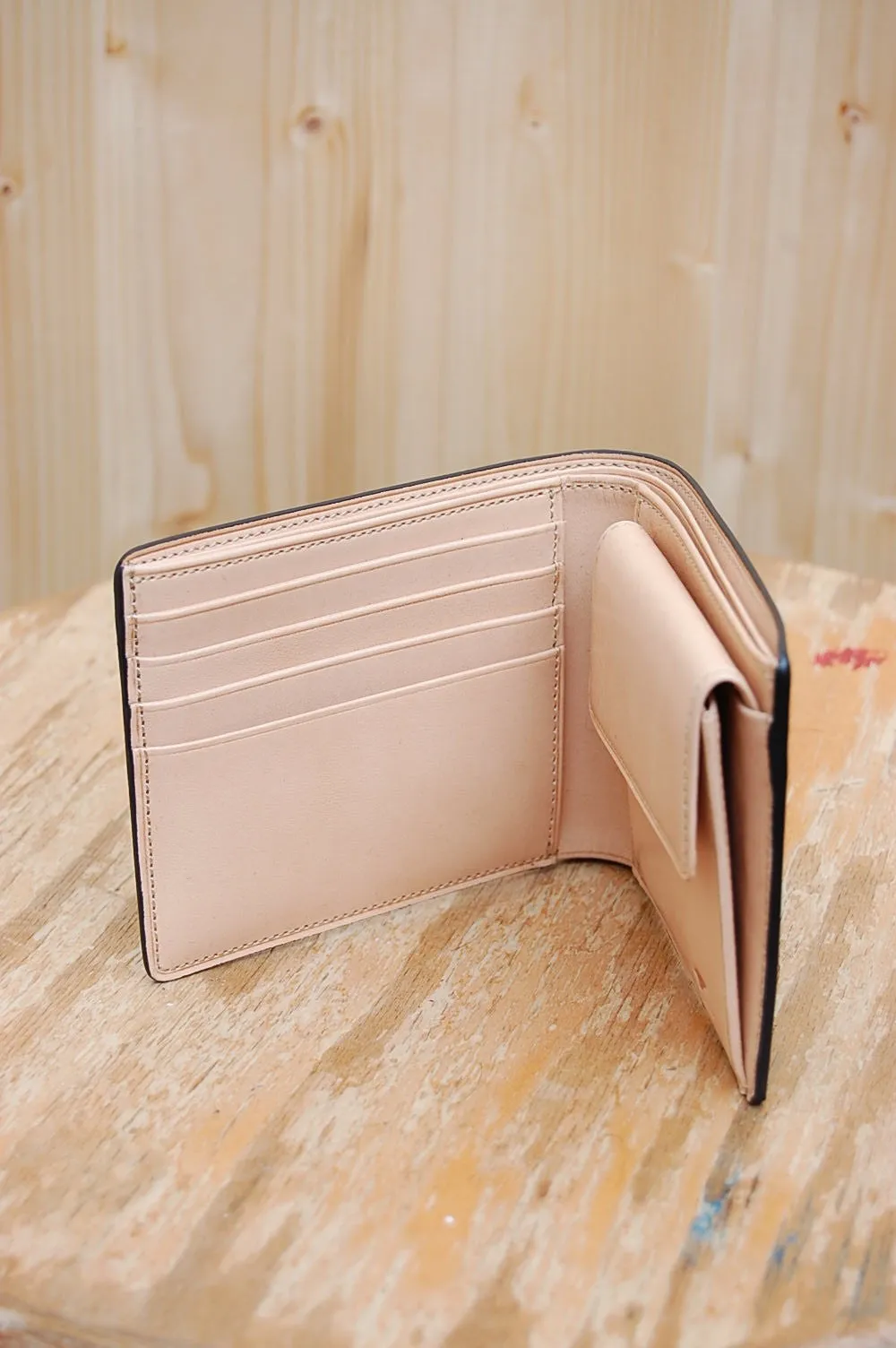 Bussetto black bi-fold wallet with coin pocket.