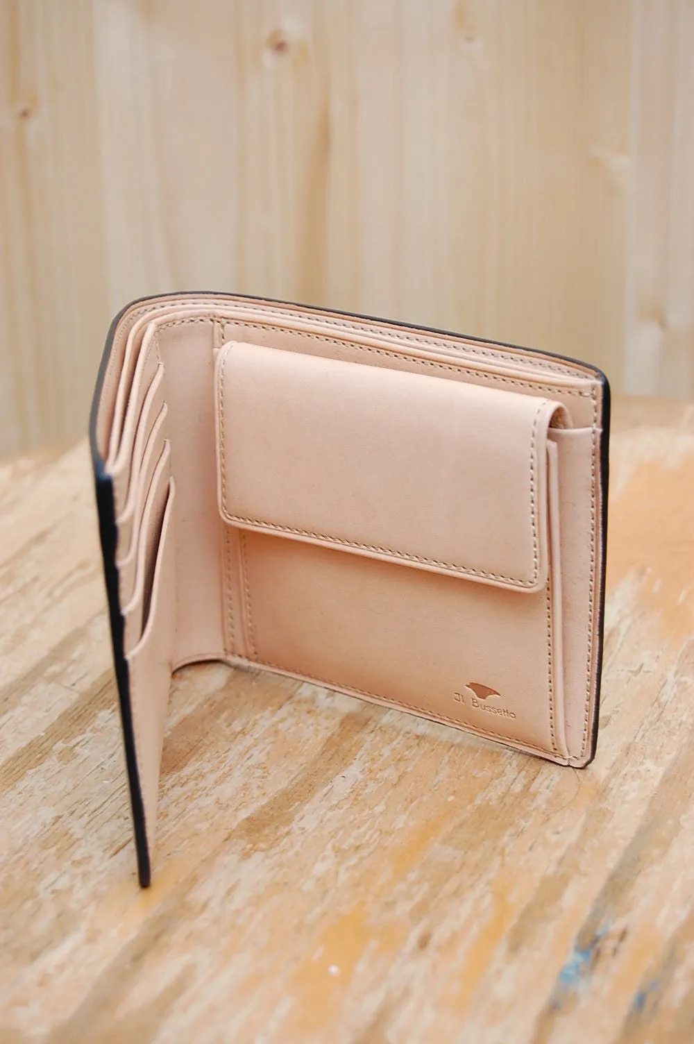 Bussetto black bi-fold wallet with coin pocket.