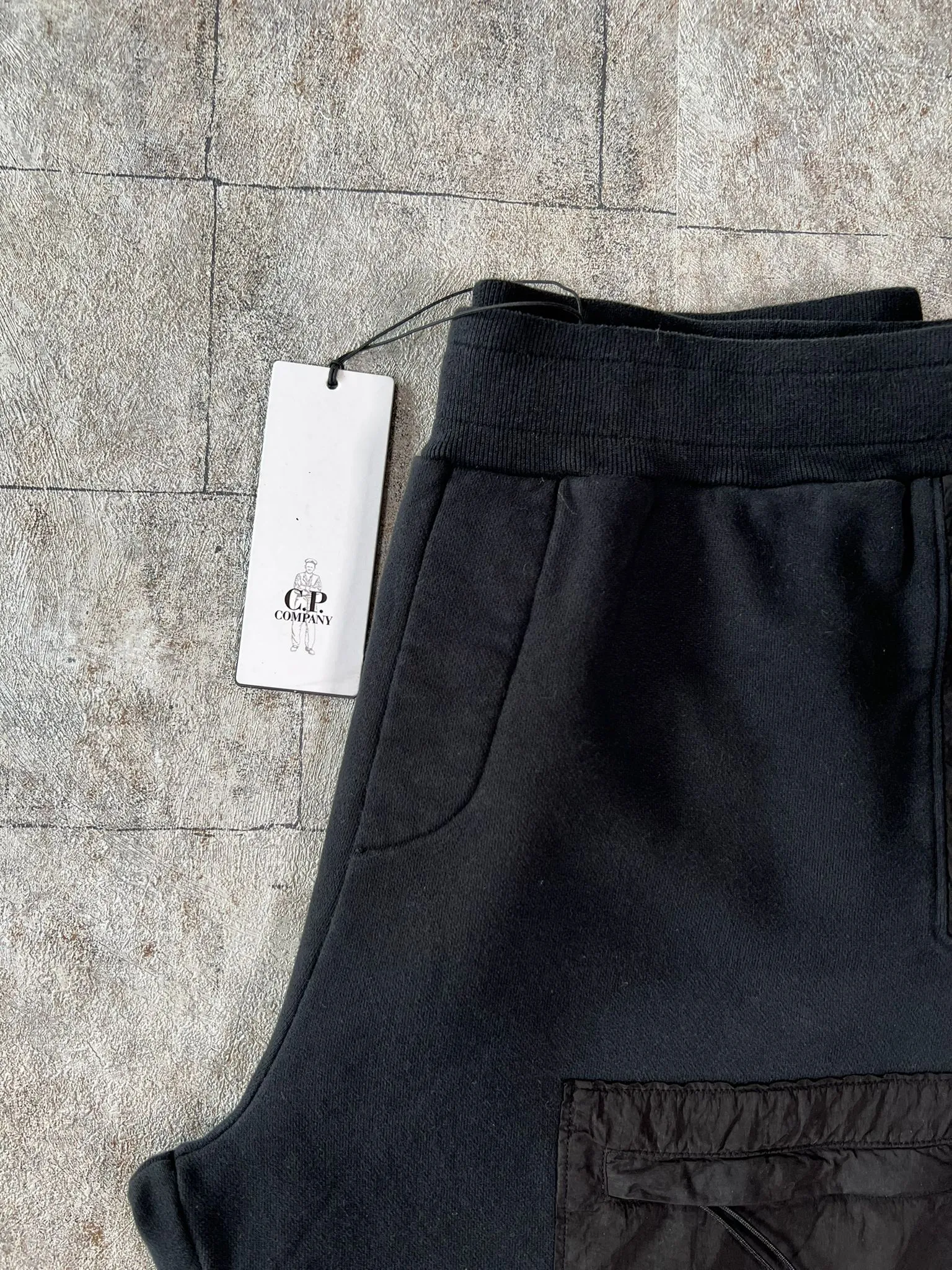 C.P. COMPANY MIX LENS SWEATPANTS